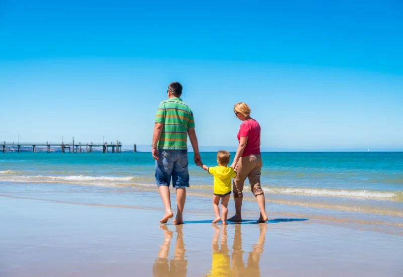 grandparents on beach with child First Financial